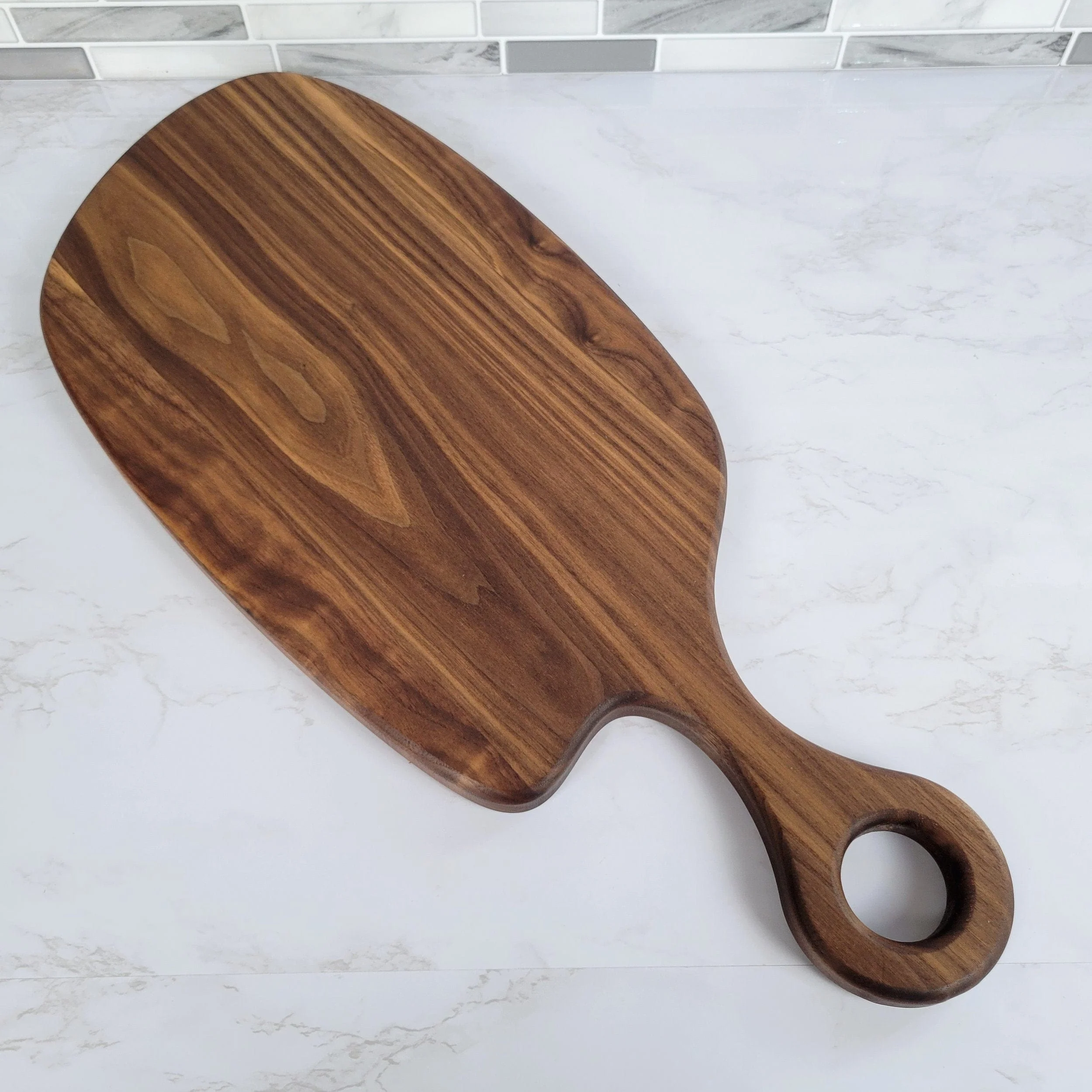 Black Walnut Charcuterie Board with Organic Curves and Round Handle - Image 3